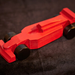 A red wooden race car.