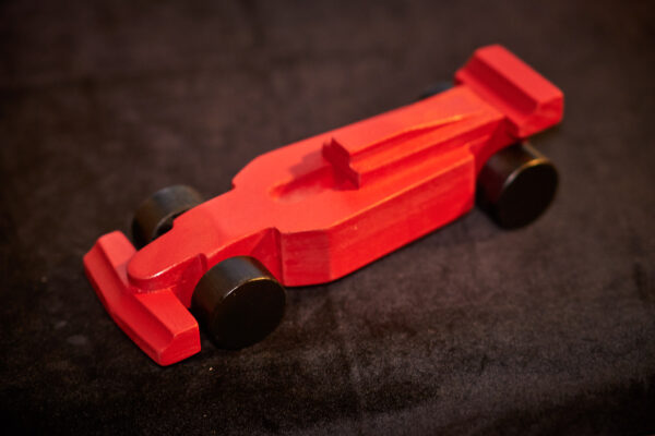 A red wooden race car.