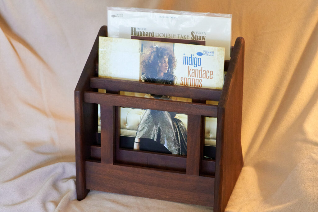 An LP stand, with two records.